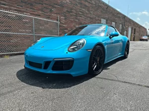 Porsche 911 Targa 4 GTS parked outside of the Nathan's Detailing shop